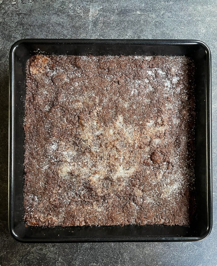 Chocolate concrete was so named because as this chocolate style shortbread cooled, it became very hard and crunchy, like concrete.

But don't let the name put you off, it's actually a very popular and delicious style bake, especially when served with custard.